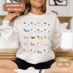 Wrap yourself in cozy comfort with this cute Dachshund crewneck sweatshirt, perfect for any dog mom and Doxie lover. This charming Wiener Dog women's shirt makes an ideal gift for dog moms who adore their Dachshund companions. 𝑻𝒉𝒆 𝑭𝒊𝒕 ⏳ Ribbed knit collars to bolster shaping ⏳ No itchy side seams ⏳ Ideal for any situation ⏳ Unisex heavy blend crewneck sweatshirt 𝑻𝒉𝒆 𝑫𝒆𝒕𝒂𝒊𝒍𝒔 This classic unisex jersey short sleeve tee fits like a well-loved favorite. Soft cotton and quality print Mom Crewneck, Dachshund Shirt, Dog Mom Sweatshirt, Sweatshirt Cute, Wiener Dog, Mom Sweatshirt, Gift For Dog, Comforters Cozy, The Details