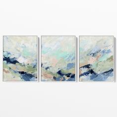 three abstract paintings hanging on the wall