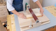 a person using a table saw to cut wood