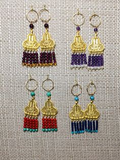 SPECTACULAR genuine natural gemstone earrings on 14k gold filled hoops! These earrings are perfect to wear with historic clothing from ancient Greece, Rome and Persia as well as India and China, Byzantium.... Please use the drop down menu to see each pair of earrings in detail. These earrings can be switched onto french wires for no extra charge. All of these earrings are on either 14k gold fill or sterling silver hoops or ear wires. The other metal components are as follows: The crescent tops a Gold Laurel Wreath, Gold Filled Hoops, Historic Clothing, French Wire, Coral Turquoise, Sterling Silver Hoops, Ancient Greece, Historical Clothing, Silver Hoops