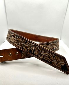 This Item Is Made To Order! Customize Your Very Own Belt With Your Name, Brand Or Any Other Design You May Want! Please Message Me After Your Order For A Video On The How To Send Your Measurements! Also Please Message Me Before Ordering To Make Sure We Come Up With What You Want! Handmade Custom Leather Belts, Artisan Handmade Leather Belt Buckles, Handmade Artisan Leather Belt Buckles, Custom Engraved Leather Belt Buckles, Handmade Leather Belts For Everyday Use, Custom Handmade Leather Belts, Hand Tooled Leather Belt Gift, Artisan Leather Belts For Gifts, Traditional Hand Tooled Leather Belt Buckles