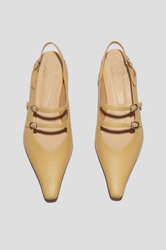 The Cata Buckle Flat is meant for the occasions when we want to stand out and feel in command. A statement shoe in every sense of the word, this shoe is meant for making a powerful impression. The double buckle mary jane/slingback silhouette is formidable, yet functional paired back to daywear, and sultry when styled for a night out. We love this shape styled with suiting as well as slip dresses. Who it’s for: The woman who knows that others will be taking notice. Kidskin leather upper with vegetable tanned leather lining, nickel toned buckles and a tonal leather sole. Heel height: 18 mm Handmade in Argentina. Buckled Flats, Slip Dresses, Statement Shoe, Loafer Mules, Flat Boots, Heeled Loafers, Boot Sandals, Vegetable Tanned Leather, Heel Height