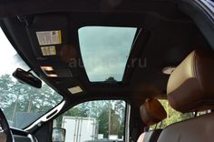 the interior of a vehicle with its sunroof open