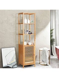 a wooden shelf next to a bath tub in a room with a painting on the wall