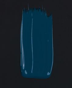 a close up of a blue toothbrush on a black background