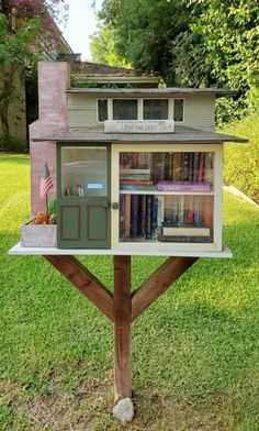 a little library in the shape of a tree