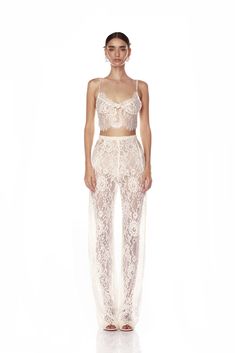 Enhance your ensemble with our Capri Blanc Lace Bridal Bralette. Spaghetti straps Adjustable double clasp closure Scalloped hem Bridal Pants, Bronx And Banco, Lace Blazer, Lace Pants, Lace Bridal, Scalloped Hem, Bridal Lace, Lace Bralette, Top Model