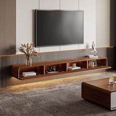 a living room with a large flat screen tv mounted on the wall next to a coffee table