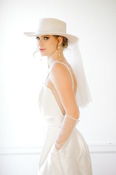 This soft beautiful hat provides the stylish and unique bridal detail , perfect for the wedding, bachelorette, or other bridal events! Info + Details: Diameter of the hat: about 34cm around                     Brim:  56-58cm                     Width of Brim:8cm                  Height:10cm Length of Veil: about 50cm Ivory color hat and tulle Hat brim is all woolen and not rigid backed May arrive pleated from shipping- can be ironed/steamed back into shape   ------------------------------------- Boho Bride Hat With Veil, Wedding Hats For Bride Boho, White Veil Hat, Luxury White Boater Hat For Wedding, White Bridal Hats, Boho Hat With Veil, Bride Boho Hat, Wedding Dress With Wide Brim Hat, Tulle Hat