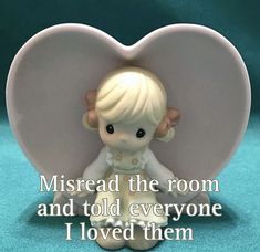 a little angel figurine sitting in front of a heart with the words, misread the room and told everyone i loved them