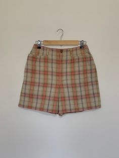 "Awesome high waisted 90's plaid shorts. High waisted fit, looser through the hips, and two front pockets. Button and zipper closure in front. Classic 90's multi colored plaid pattern. Shorts are in excellent clean condition. Measurements are taken zipped or buttoned up and laid comfortably flat then x 2 for total circumference (inches) Liz Claiborne Tag Size 10 100% Cotton Waist 28\" Hips 42\" Length 16.5\" Inseam 5\" Rise 12\" Bottom leg Opening Circumference 26\" All items are free of rips, t High Waist Plaid Summer Bottoms, Retro Plaid Bottoms With Pockets, Retro Plaid Bottoms For Spring, Plaid Bottoms With Built-in Shorts For Spring, 90s Style Shorts With Belt Loops, 90s Fitted Shorts, Vintage High Waist Plaid Bottoms, Fitted 90s Style Shorts, Vintage Plaid Bottoms For Summer