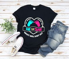 "Gender Reveal shirt with the quote \"He Or She What Will Baby Be\" is a fun gift for men and women!  To see more designs of your topic Gender Reveal you can search & find them in my store:   https://www.etsy.com/shop/Retailorie  You find there also an announcement if the shipping & production times change :) * All Shirts Are Unisex * Product measurements may vary by up to 2 inches. * All Designs are originally made by myself or my team  he or she shirt,gender reveal shirt,baby shower shirts,pregnancy reveal,pregnancy tshirt, pregnant shirt,baby shower gift,gender reveal gift,gender reveal ideas," Gender Reveal Tshirt Ideas Parents, Black Letter Print Shirt For Gender Reveal, Black T-shirt With Funny Text For Gender Reveal, Funny T-shirt For Gender Reveal With Letter Print, Funny Letter Print T-shirt For Gender Reveal, Funny T-shirt For Gender Reveal, Casual Shirt With Name Print For Gender Reveal, Unisex Casual T-shirt For Gender Reveal, Black Graphic Tee For Gender Reveal