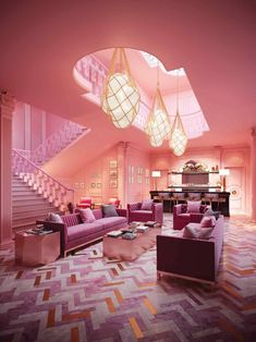 a living room filled with pink furniture and chandelier hanging from the skylight