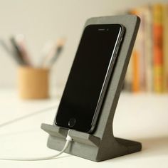 a cell phone is hooked up to a charging station