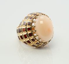 Angel Skin Coral Ring, Pink Coral Sea Coral Cocktail Ring, Red Enamel Ring, 18K Gold Ring, Oval Ring, Domed Ring, Elegant Ring, Estate Ring. This spectacular vintage ring is finely crafted in solid 18K Yellow Gold and set with a gorgeous Coral cabochon in the center. The angel skin pink Coral measures 18mm x 13mm. The stone is beautiful, with no sign of age. The red enamel is in excellent condition, no chips, no missing enamel. The top of the ring measures 25mm, the setting raises 15mm high abov Luxury Domed Cabochon Rings, Fine Jewelry Yellow Gold Dome Ring With Cabochon, Fine Jewelry Dome Ring In Yellow Gold With Cabochon, Luxury 14k Gold Dome Ring With Oval Cabochon, Luxury Yellow Gold Dome Ring With Oval Cabochon, Unique Yellow Gold Oval Dome Ring, Unique Oval Dome Ring In Yellow Gold, Oval Cabochon Enamel Ring Collectible, Elegant Gold Domed Cabochons