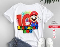 a white shirt with an image of mario birthday boy on it, next to some shoes