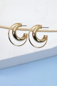 This dual thin and thick can give the earring a modern and stylish look, making it stand out while still maintaining the timeless appeal of hoop earrings. The combination of thin and thick elements adds depth and dimension to the accessory, making it a versatile and eye-catching piece of jewelry. Product details:length: 1"width: 1" earring back: Postmetal finish: Gold Platingproduct: Lead & Nickel Compliantanti-tarnish: Double E-coating Double Hoop Earrings, Post Metal, Sunglass Chain, Faux Leather Belts, Steel Necklace, Color Calibration, Monogram Initials, Earring Backs, Ring Bracelet