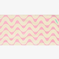 a pink and white wave pattern with a blue sticker on it