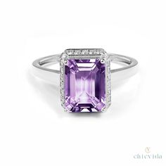 DetailsMaterial: 14k/18k goldColor Options: Yellow Gold, White Gold, Rose Gold★ Center StoneAmethyst, OctagonSize: 7.30 x 9.85mmApprox Weight (Ct): 2.9★ Accent StonesDiamond RoundSize: 1.3 mm * 26 Nos.Approx Weight (Ct): 0.182 Purple Engagement Ring, Wedding Ring Emerald Cut, Purple Engagement Rings, Wedding Ring Emerald, Amethyst Wedding Ring, Engagement Ring Hidden Halo, Amethyst Wedding Rings, Wedding Rings Emerald Cut, Amethyst Wedding