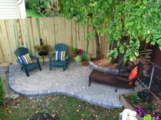 an outdoor patio area with chairs and a fire pit