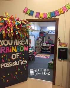 a classroom decorated with colorful streamers and confetti on the front door for teachers