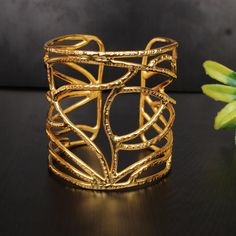 Traditional Cuff Bangle, Women Adjustable Bangle, Handmade Bangle, Designer Bangle, Gold Plated Bangle, Partywear Bangle, Hammered Jewelry Description : ✦Material : Brass ✦Weight : 59.87 Gram Approx ❣❣ Handmade Item ❣❣ **Made to Order** » C U S T O M I Z E O R D E R « All gemstone jewelry is made with silver and brass. If you want to make any changes with this jewelry, then please send us a message. We will make as per your requirements. For more beautiful designs please visit our Etsy shop belo Unique Adjustable Bangle For Party, Handmade Adjustable Bangle For Parties, Adjustable Handmade Bangle For Party, Handmade Party Bangle Bracelet, Gold Cuff Bracelets For Party, Handmade Bangle Bracelets For Party, Handmade Cuff Bracelets For Party, Bohemian Cuff Bracelets For Party, Gold Party Bangle With Bracelet Strap