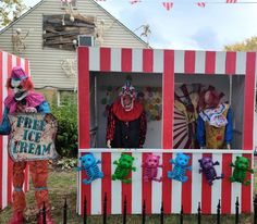 two creepy clowns are standing in an ice cream stand