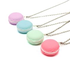 "Who doesn't love a pretty and delicious French Macaron? And now you can wear this yummy cookie as a necklace! Macaron pendants: round cookies with the classic \"foot\" around the side, filled with delicious piped whipped cream! You can choose your favorite color: strawberry (reddish) pink, pastel purple, blue, or mint green. This cute charm necklace makes a great addition to any macaron lovers jewelry collection and a great gift for a friend or woman in your life who loves kawaii or fun handmad Emo Accessories, Jewelry Kawaii, Pastel Necklace, Purple Cute, Violet Pastel, French Macaron, Miniature Food Jewelry, Kawaii Jewelry, Kawaii Gifts