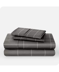 two sheets with black and white squares on them, one is folded up to the side