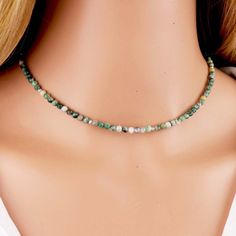 The choker is adorned with small round beads, each measuring 3mm in diameter. These beads are meticulously crafted from green jade, a precious gemstone revered for its rich green hues and cultural significance. Color and Characteristics: Green jade is known for its lush and soothing green color, symbolizing harmony and balance. The beads may exhibit variations in shade, showcasing the natural diversity of the stone. The 3mm size adds a delicate touch to the necklace while allowing the vibrant green color of the jade to shine. Materials:  Green Jade, Silver/gold Plated Metal Beads. Jade Size: 3mm Spacer Beads: 2mm Closure: Lobster Clasp Chain Extender: 2 inches Note: If you choose the gold finish, the spacer beads will be gold. If you choose the silver finish, the spacer beads will be silve Dainty Adjustable Choker With Spacer Beads, Dainty Adjustable Choker With Faceted Beads, Adjustable Faceted Beads Choker As A Gift, Adjustable Hand-strung Round Beads Choker, Adjustable Hand-strung Choker As Gift, Gift Choker With Tiny Round Beads, Adjustable Round Beads Faceted Choker, Adjustable Faceted Round Bead Choker, Adjustable Choker With Faceted Round Beads