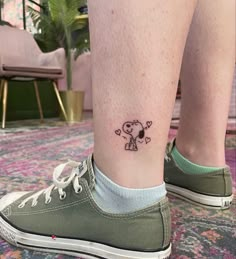 a person with a small tattoo on their leg