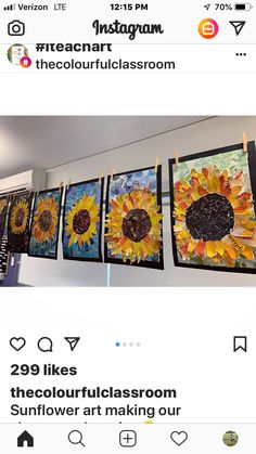 the sunflower art is hanging on the wall