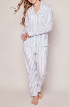 Cozy up in these luxuriously soft pima-cotton pajamas patterned in sweet stripes and designed with elevated details like piped edges. 31" inseam Top has front button closure; notched collar; long sleeves; chest patch pocket Pants have elastic/drawstring waist 100% pima cotton Machine wash, tumble dry Made in Peru Cotton Sleepwear With Vertical Stripes For Loungewear, Striped Relaxed Fit Sleepwear, Striped Relaxed Fit Sleepwear For Home, Relaxed Fit Striped Sleepwear For Home, Pajama Pattern, Cotton Pajamas, Cotton Pyjamas, Pocket Pants, Notched Collar