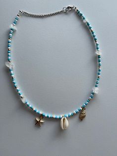 Thalassophile at Heart - Etsy Handmade Blue Summer Jewelry, Handmade Summer Blue Jewelry, Blue Strand Necklaces For Beach Season, Handmade Gold Charm Necklace For Vacation, Blue Necklaces For Summer Beach, Blue Strand Shell Necklace In Beachy Style, Turquoise Heishi Beads Jewelry For Vacation, Blue Strand Necklace With Beachy Style, Beach Season Jewelry With Beaded Chain