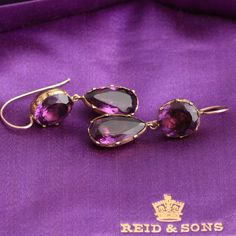 ((about))At the time these paste earrings were made, amethysts were considered to be equal in value to sapphires and rubies. Being rare, expensive and desirable, the paste version of the purple gem was very popular in the late 18th and 19th centuries. These "amethyst" paste earrings were most likely converted from a larger piece of jewelry, possibly a necklace. The glass gems are mounted in foiled-backed dished gold settings with the distinctive Georgian style crimped collets. ((details)) Materi Purple Fine Jewelry Earrings For Formal Occasions, Amethyst Earrings Fine Jewelry For Formal Occasions, Formal Amethyst Gemstone Earrings, Amethyst Gemstone Earrings For Formal Occasions, Amethyst Briolette Earrings For Formal Occasions, Formal Amethyst Briolette Earrings, Classic Purple Drop Earrings, Formal Amethyst Drop Earrings, Elegant Purple Briolette Earrings