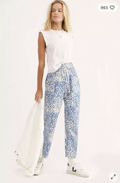 Designed in a high-rise, slouchy silhouette, these piece-printed pants feature tapered legs and exaggerated pockets for added shape. Elastic waistband Four-pocket style Pieced print fabrication Machine Wash Cold New without tags. Label marked to prevent store returns Approximate Measurements for size small Inseam: 27.25 in Waist: 30 in Rise: 14 in Chic Printed Cotton Bottoms, Blue Printed Bottoms With Relaxed Fit, Blue High Waist Printed Bottoms, Blue High Waist Printed Pants, Blue High-waist Printed Bottoms, High Waist Printed Blue Pants, High Waist Blue Printed Pants, Blue Floral High-waisted Pants, Printed Linen Pants