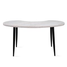 a white marble table with black legs