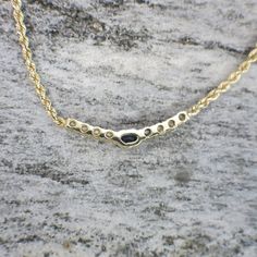 An oval deep blue sapphire is set in the center of this 14k yellow gold rope chain necklace. Four diamonds on each side of the sapphire bring a white brilliance to the sapphire and make this necklace sparkle! Metal: 14K Yellow Gold Diamond: .40 CTW, SI1-2, G-H Sapphire: 5 x 3 MM Length: 16 Inches SKU: N1250 For a greater selection of jewelry please visit our website at www.BlackMarketLLC.com If you have any questions about this product or if we can help you with any of our other products please Exquisite Round Sapphire Necklace, 14k Gold Round Sapphire Necklace, Luxury Sapphire Round Necklaces, Round Sapphire Diamond-accented Necklace, Luxury Oval Sapphire Necklace, Rope Chain Necklace, Gold Rope Chains, Alternative Engagement Rings, Brilliant Diamond