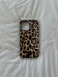 a cell phone case with a leopard print on the front and back cover that says, this phone came out