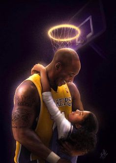 two basketball players embracing each other in front of a hoop with the lights on behind them