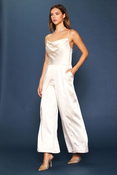 This strappy cowl-neck jumpsuit is a chic statement for this season's special occasions. It's got a beautiful drape up top and a breezy wide-leg silhouette. •Cowl neckline  •Adjustable spaghetti straps  •Pleated front  •Wide-leg silhouette  •Hidden zipper at back  Item Number: 74292 Satin Jumpsuit, Cowl Neckline, Beautiful Drapes, Item Number, Hidden Zipper, Cowl Neck, Size 16, Spaghetti Strap, Champagne