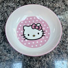 a bowl with a hello kitty design on it