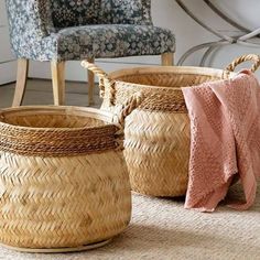 three woven baskets sitting on top of a rug