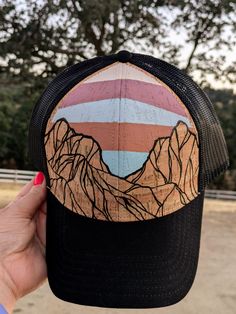 One-of-a-kind Hand Painted Hat Top Quality OTTO brand cork hat, Adjustable and comfortable, One size fits most (This is a structured style hat, not floppy or flimsy) My line of hand painted hats is inspired by the natural beauty God created in the mountains, beach, desert, and other places I like to wander. I freehand paint these designs directly on the hat. Because of this, no two hats will ever be exactly the same. Please see my other hat designs in my shop. These are painted using high qualitly acrylics, and then topped with a matte sealer for protection. These will stand up to normal use, but please do not submerge in water. Everything at TheLeatherKnot is handmade by me, with Love! Fast and free shipping on every order! Casual Trucker Hat With Short Brim For Outdoor Activities, Brown Brimmed Snapback Hat For Outdoor, Hand Painted Hats, Paint Cork, Painted Hats, In The Mountains, Hat Designs, Trucker Cap, Hat Fashion