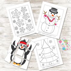 four snowman and penguin coloring pages on a wooden table