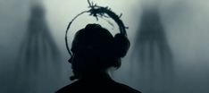 the silhouette of a person with headphones on