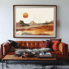 a living room with a couch, coffee table and painting on the wall above it