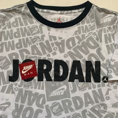 Nike Air Jordan Youth Boy's T- Shirt . Brand New With Tag . Color Is White , Gray , Black And Red . Size Med , Lg And Xl . Casual White T-shirt With Name Print, White Graphic Tee With Name Print, White Sporty T-shirt With Name Print, White Crew Neck T-shirt With Name Print, Sporty Tan Top With Graphic Print, Casual T-shirt With Name Print In White, Casual T-shirt With Name Print, White, Casual Gray T-shirt With Name Print, Gray Casual Tops With Name Print