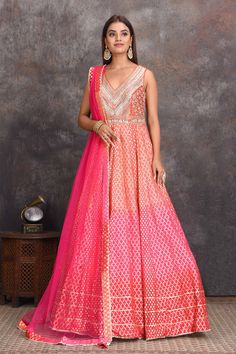 Shop beautiful peach and pink floorlength chanderi Banarasi Anarkali suit online in USA. Set a style statement on special occasions in exquisite designer lehengas, Anarkali suits, sharara suits, salwar suits, Indowestern outfits from Pure Elegance Indian fashion store in USA.-full view Festive Fitted Peach Anarkali Set, Peach Anarkali Chanderi Sets, Bollywood Chanderi Anarkali Set In Peach, Festive Floor-length Peach Anarkali Set, Banarasi Anarkali, Luxury Semi-stitched Peach Anarkali Set, Indowestern Outfits, Suits Sharara, Sharara Suits