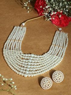 Elevate your style with the White Pearls Beaded Multistrand Statement Choker Necklace & Earring Set for Women. Featuring multiple strands of lustrous white pearls, this sophisticated set is perfect for weddings, parties, and special occasions. Crafted with high-quality materials, it combines elegance and comfort for a timeless look. Pearl White Pearl Jewelry For Celebration, Pearl White Pearl Necklace For Celebration, Pearl White Bridal Necklace For Celebrations, Festive Pearl White Bridal Necklace, Pearl Beaded Jewelry Sets For Parties, White Jewelry Sets With Pearl Chain For Celebration, Pearl Necklace For Celebrations, White Pearl Jewelry For Celebration, Party Pearl Beaded Jewelry Sets